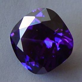Square cushion-cut faceted deep-purple amethyst close-up