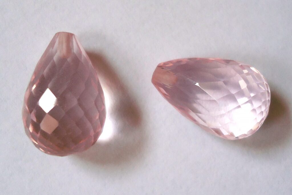Rose quartz briolette beads, as worn in pendants and necklaces