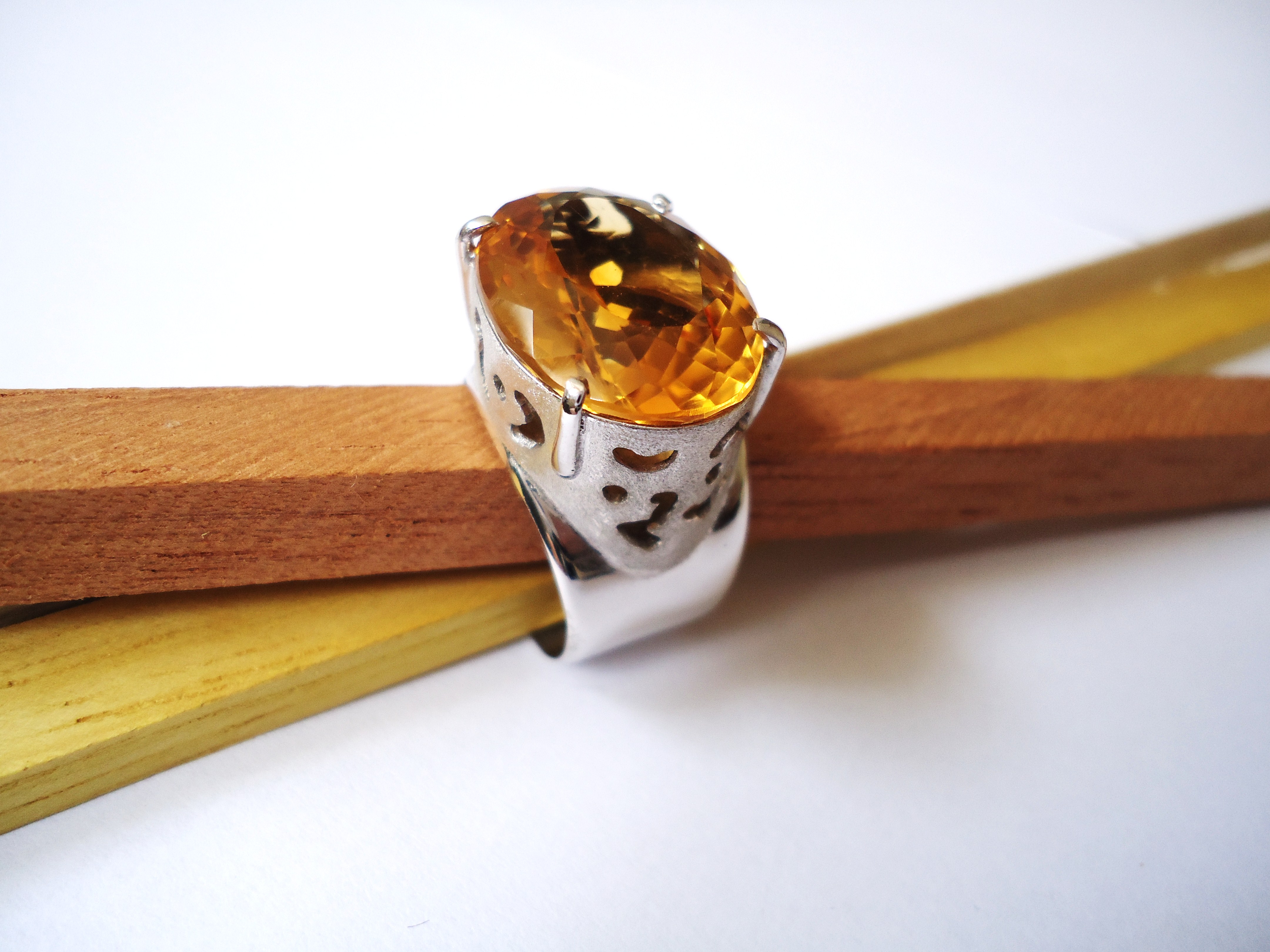 Large oval orange-gold citrine in an openwork silver ring