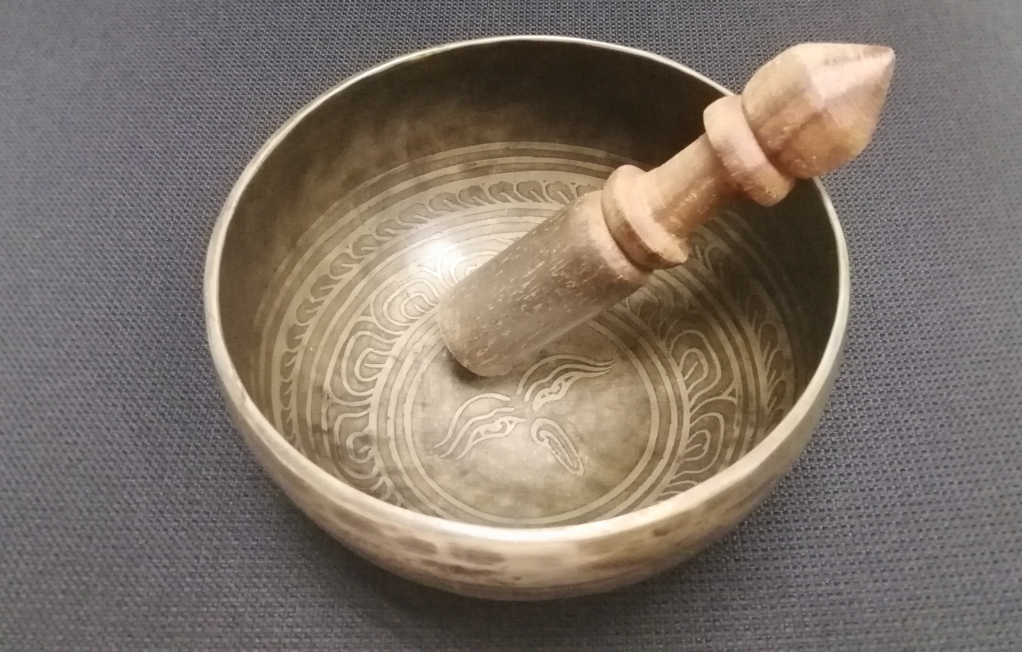 Tibetan singing bowl with wooden striker