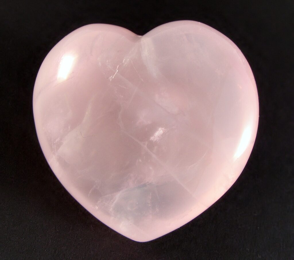 Polished rose quartz heart, a traditional gift symbolising love and care