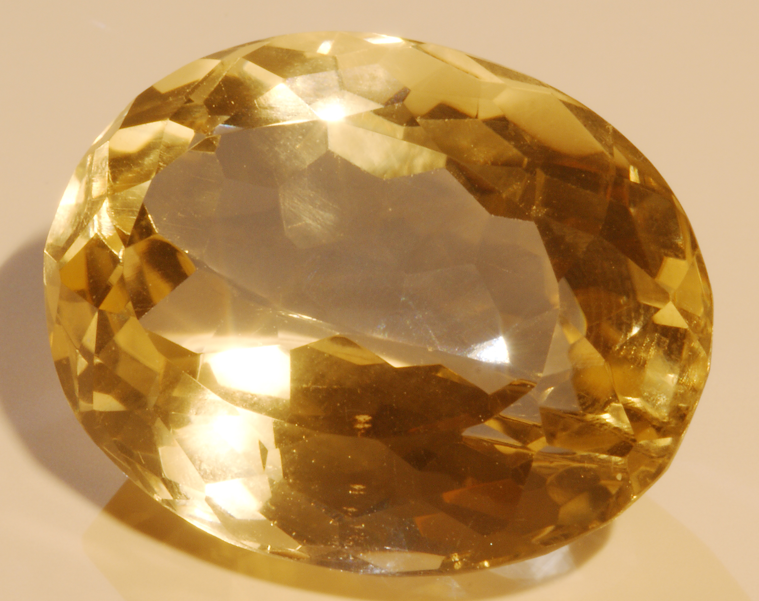 Oval faceted golden citrine gemstone