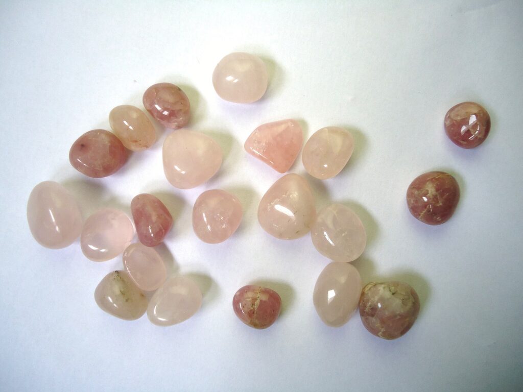 Tumbled rose quartz stones in soft pink shades