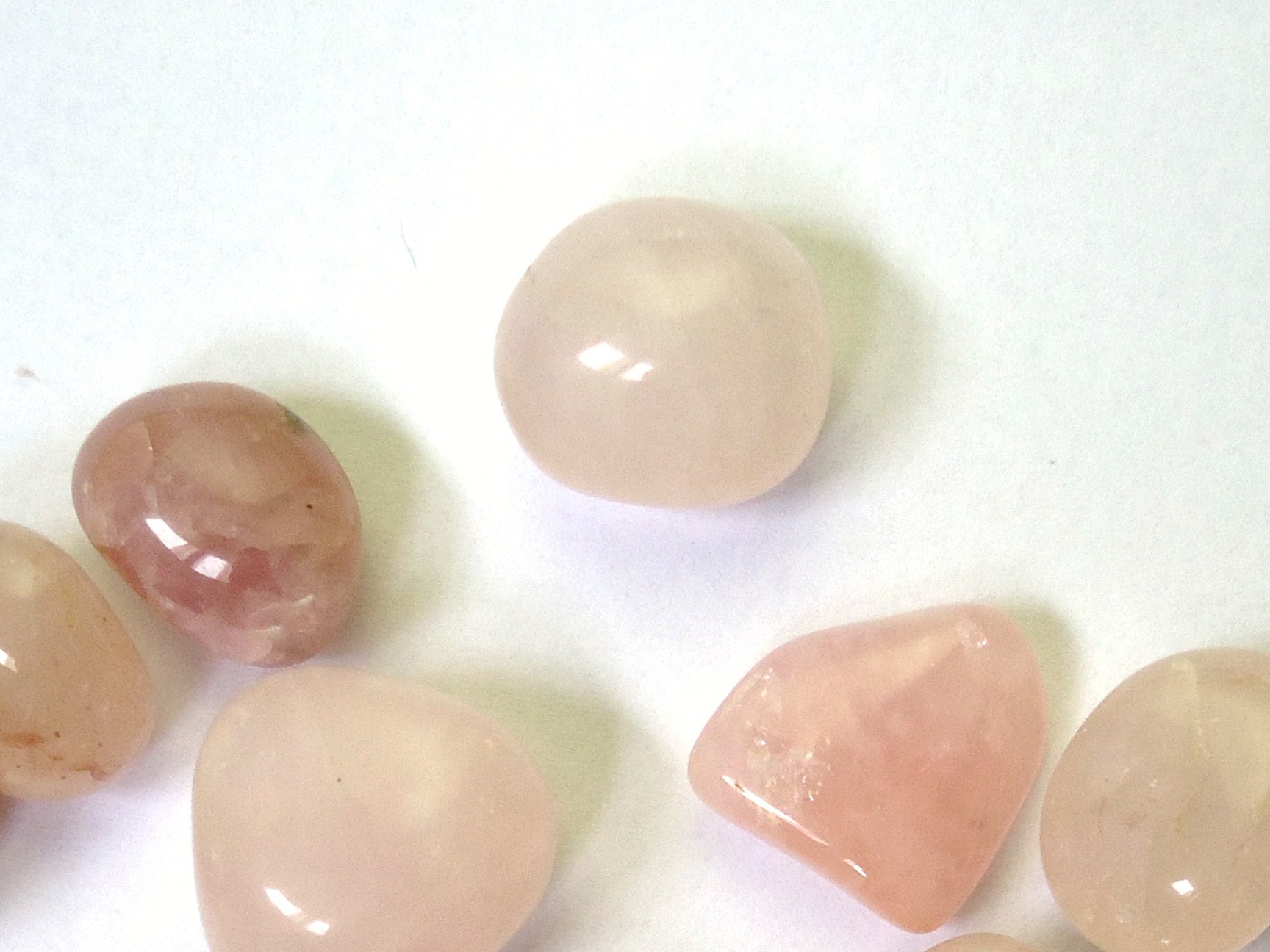 Close-up of tumbled rose quartz stones
