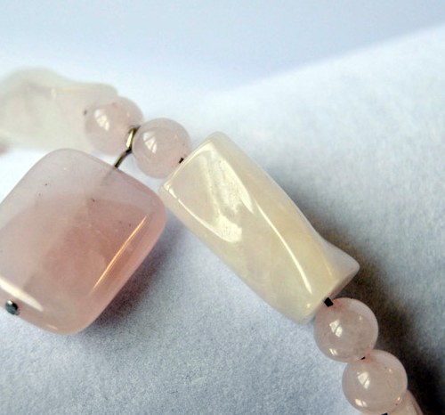 Close-up of rose quartz bracelet beads