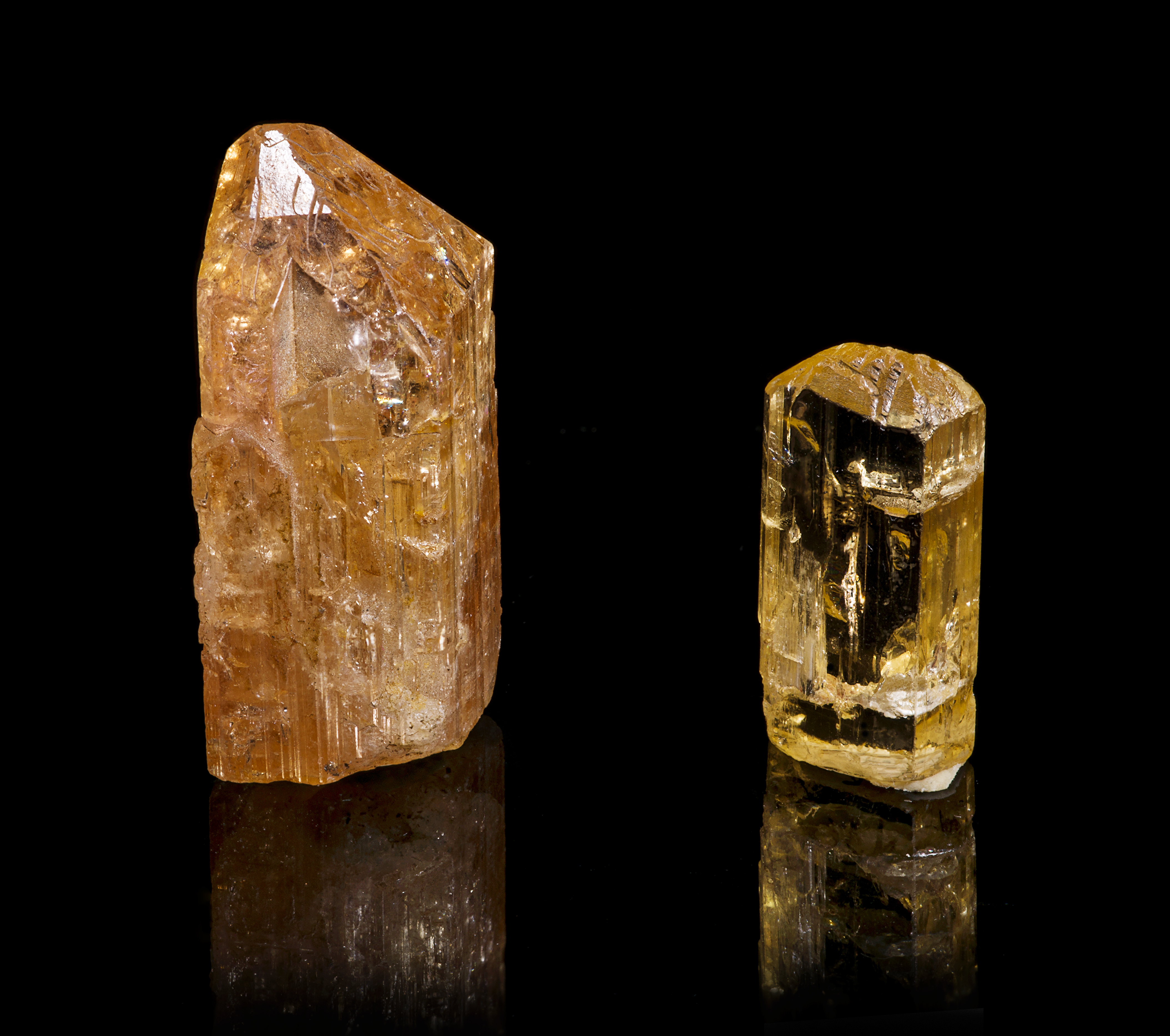 Two Brazilian imperial topaz specimens, one orange and one yellow